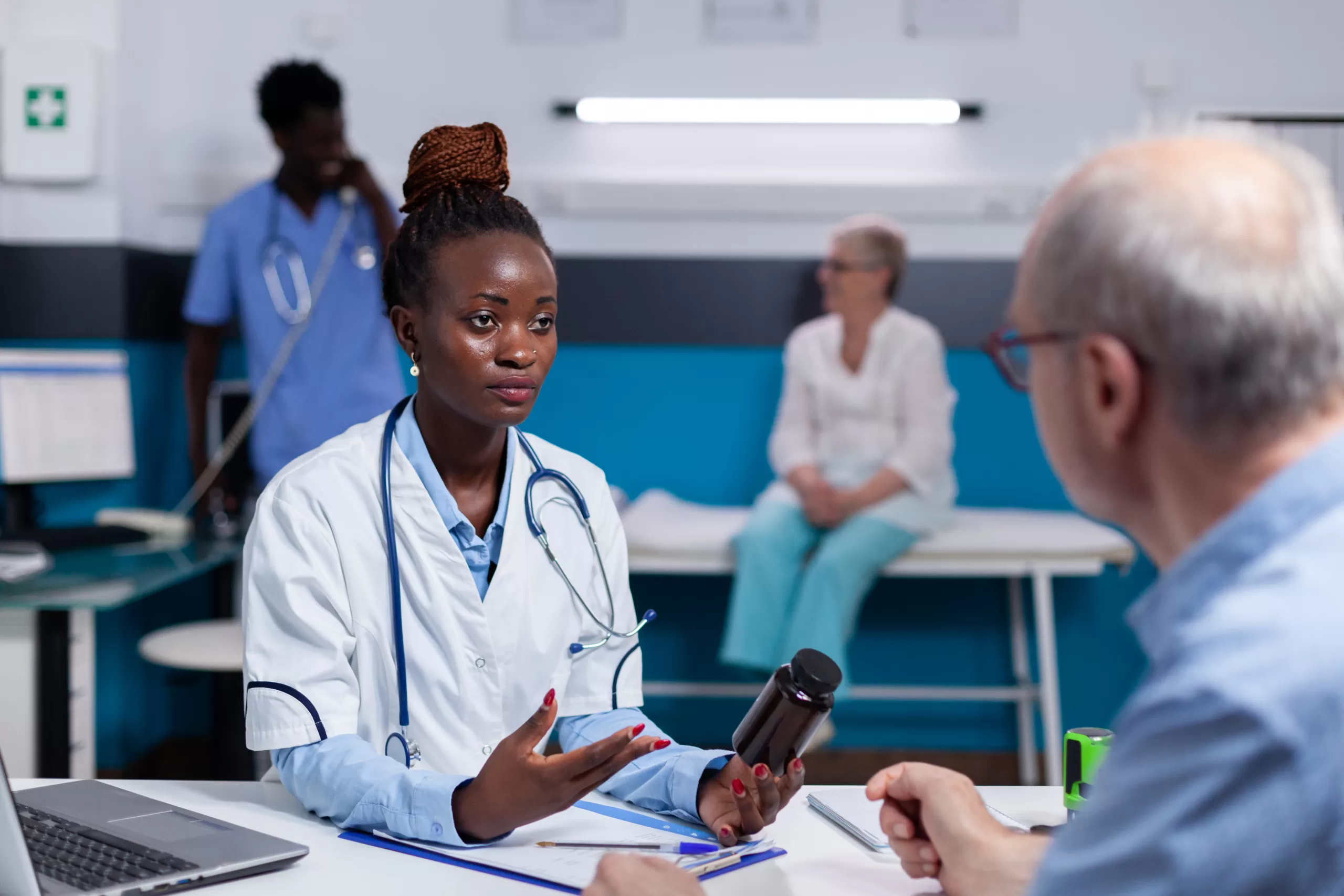 black woman with doctor profession holding bottle pills scaled Leading Healthcare Consulting Across South Africa