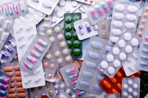 Hospaccx Healthcare Updates 3 Multiple types of pills and tablets showcased, symbolizing various medications, featuring the Hospaccx healthcare consulting firm branding